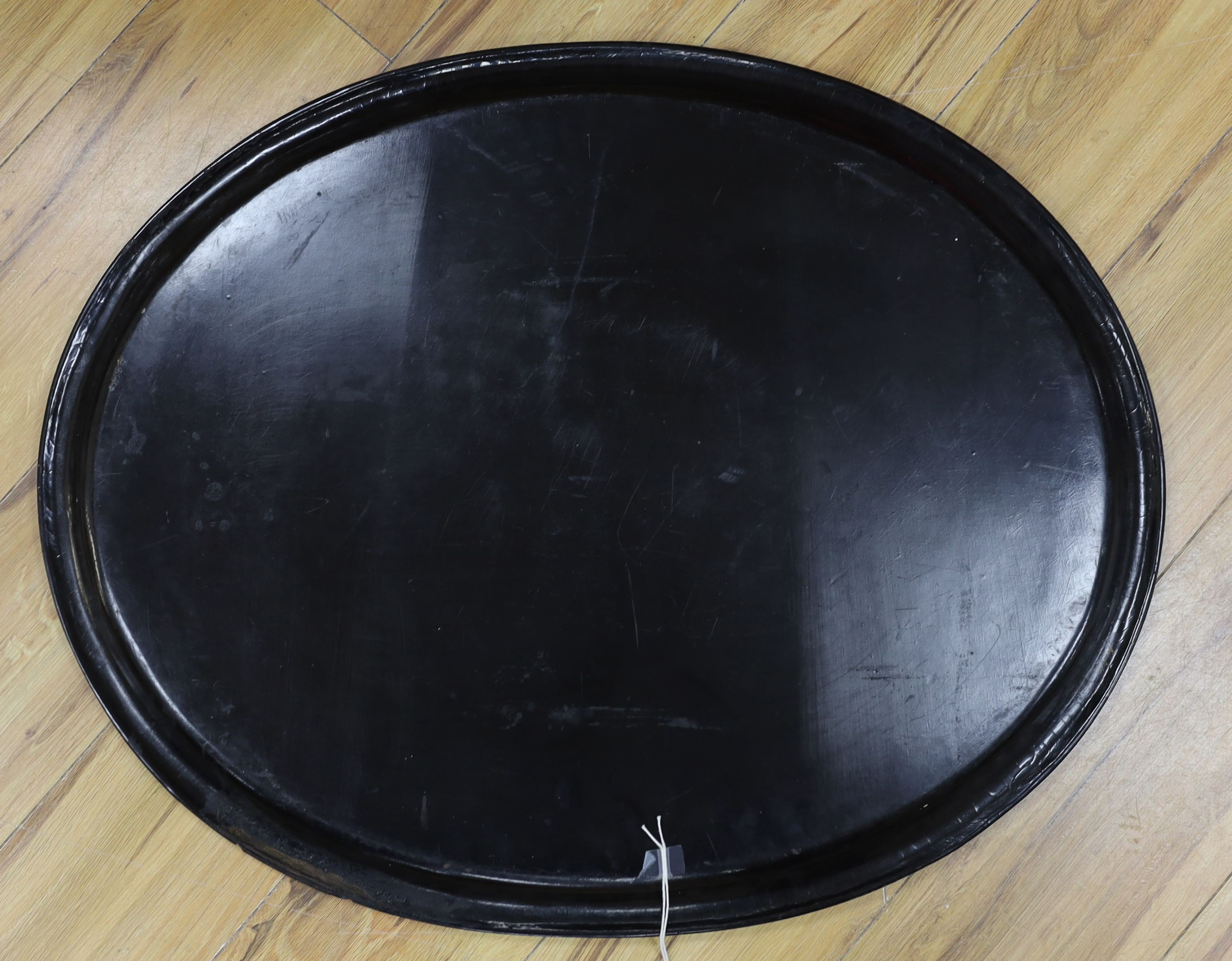 A large Victorian oval papier mache tray, 66cms wide.